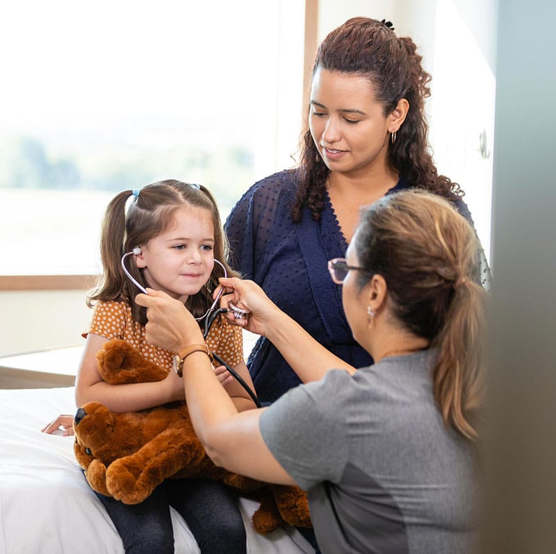 mother and daughter at urgent care clinic